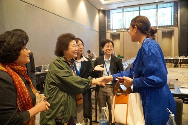 NHRC Chairperson Chen Chu congratulates Ms. Loukinikini Lewaravu, Director of the Fiji Human Rights and Anti-Discrimination Commission, on Fiji being selected to host the APF’s 30th AGM and Biennial Conference in 2025