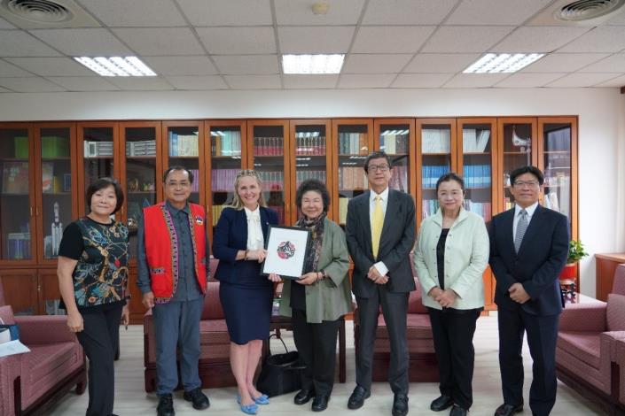 Chair Emily Ohler and Chairperson Chen Chu pose for a photo with NHRC Commissioners