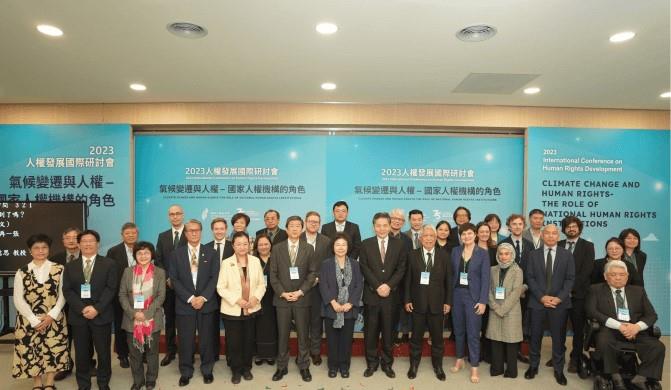 Chu Chen, Chairperson of the NHRC, poses for a group photo with the presenters, reporters, panelists, and distinguished guest speakers of the conference